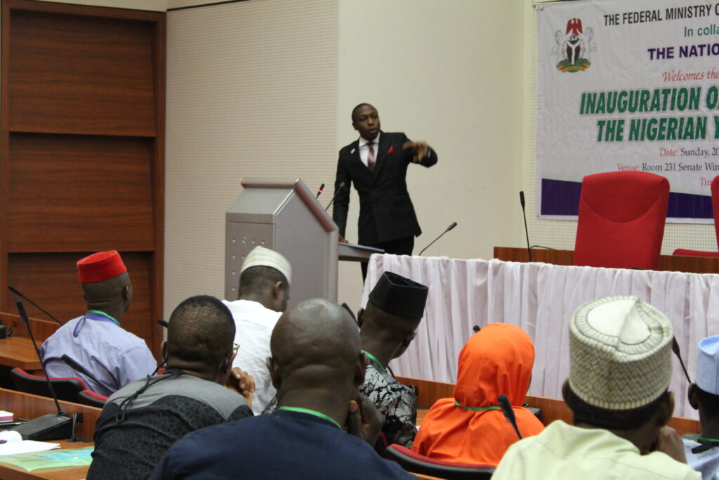 Aaron delivering a speecAaron delivering a speech at the National Assembly complex, Abuja, Nigeria to the members of the Nigerian Youth Parliament h at the National Assembly complex, Abuja, Nigeria to the members of the National Youth Parliament
